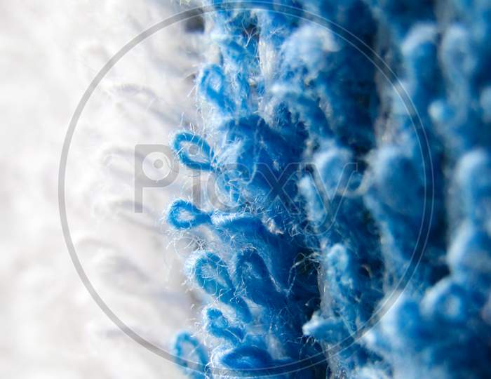 blue and white threads of a cotton fabric