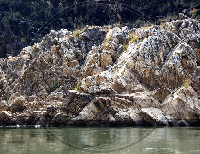 Marble Rocks On River Bank