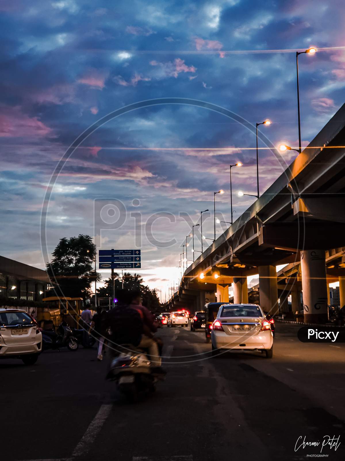 Surat city,cotton candy clouds,lights,street