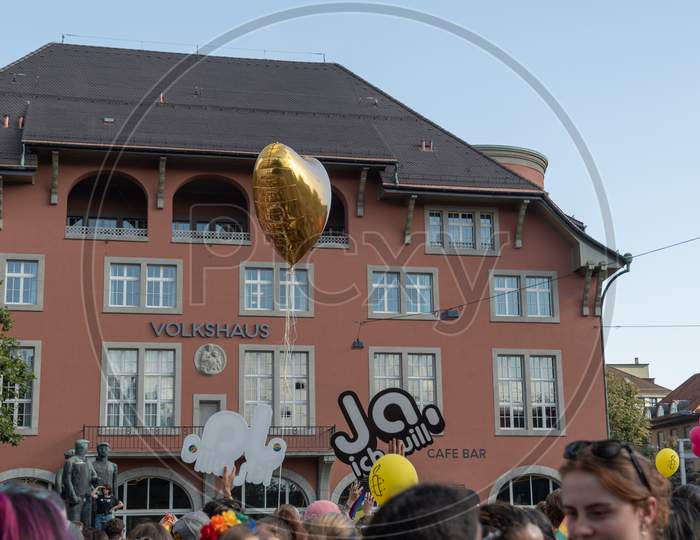 Zurich, Switzerland, September 4, 2021 Golden Heart Balloon At A Gay Pride Demo