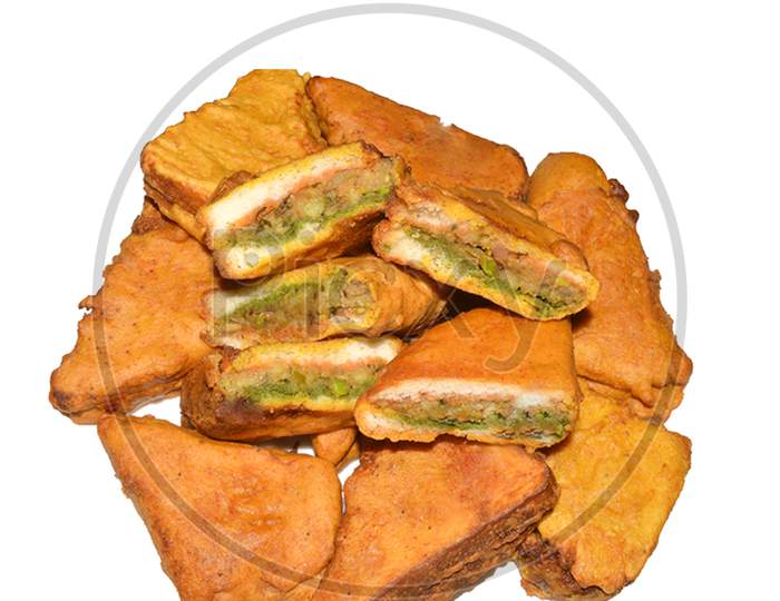 indian sandwich bread pakore, popular indian tea - time snack,fritters served with tomato ketchup and curd