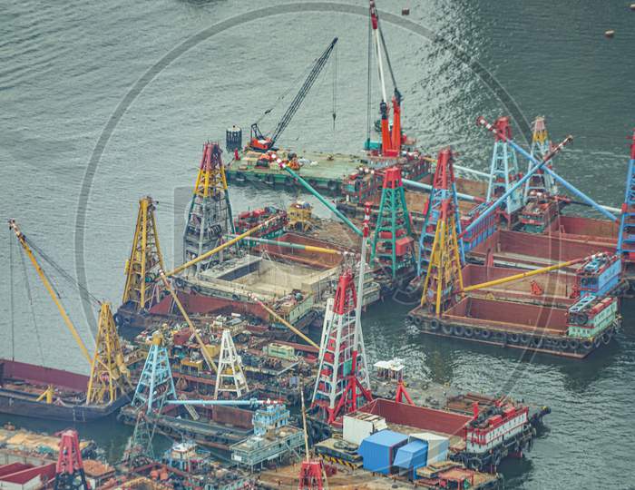 Work Boats Moored In The Harbor Of Hong Kong