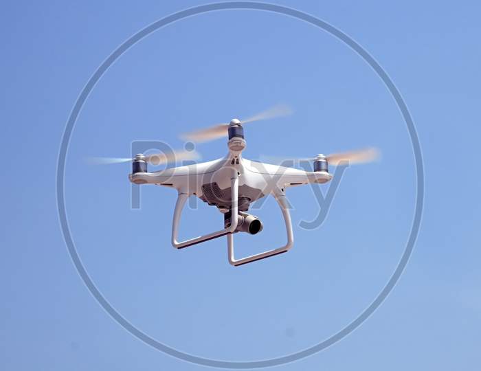 Quadcopter On A Background Of Blue Sky