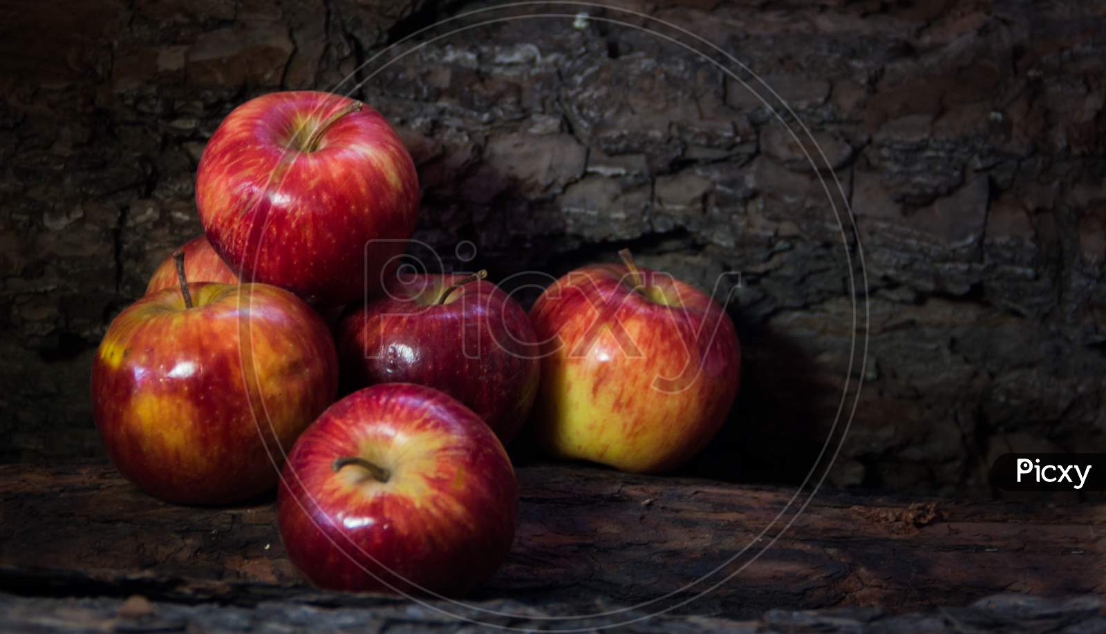 Group Of Red Apples On Dark Rustic Background