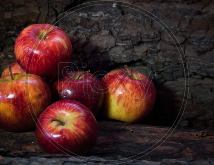 Group Of Red Apples On Dark Rustic Background