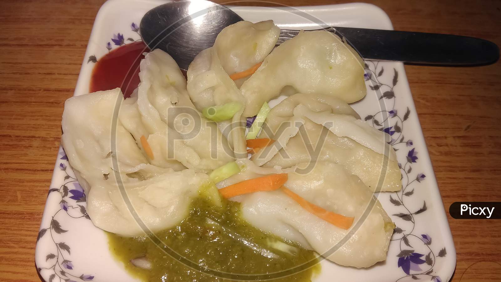Veg momo served with tomato and chilli sauce