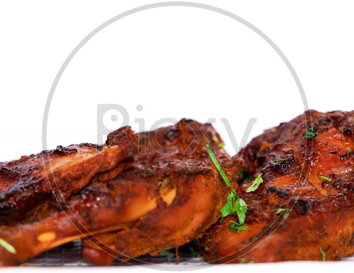 Fried Chicken Tandoori Or Chicken Grill In White Background. Side View And Selective Focus