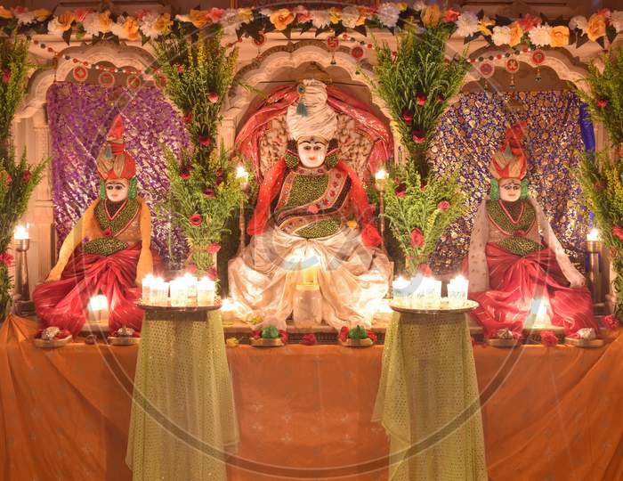 Picture Of Lord Mahavir Swami Idol Also Known As Vardhaman Mahavir Was Decorated On The Occasion Of Mahavir Jayanti With Diya And Lanterns