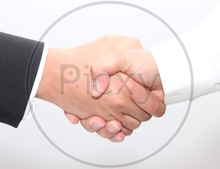 Handshake after signing the deal