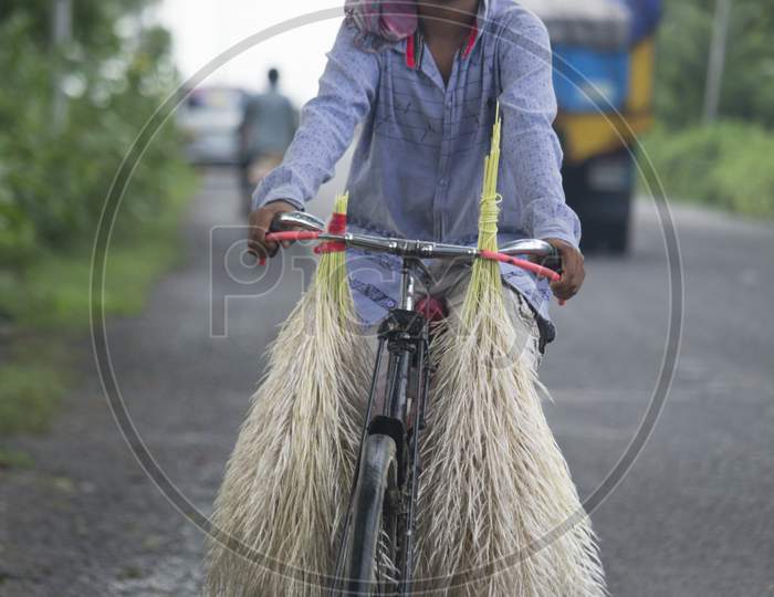 September 23, 2020, Barisal Airport, Barisal, Bangladesh. A Child Is Carrying Cashew Flowers On A Bicycle