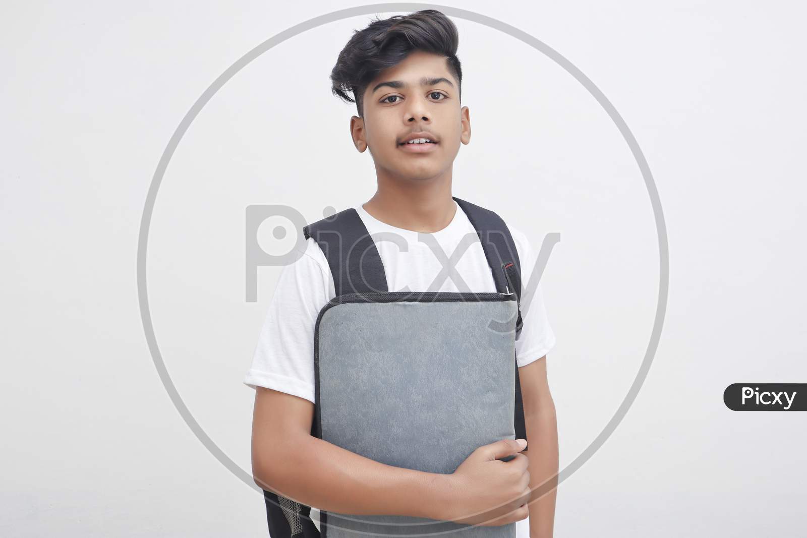 Young Indian Student Holding File In Hand.