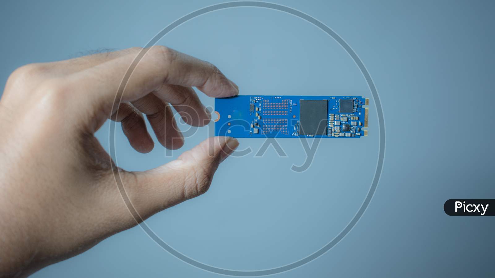 image-of-man-hand-holding-nvme-pcie-ssd-hard-drive-disk-having-high