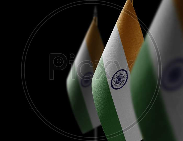 Small National Flags Of The India On A Black Background
