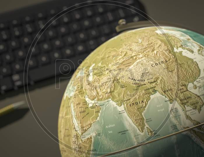 Globe On A Desktop Shows India