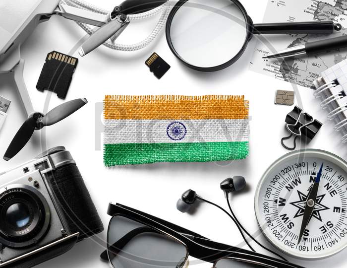 Flag Of India And Travel Accessories On A White Background.