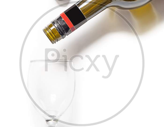 Champagne Bottle And Glass Isolated On White. Top View, Copy Space