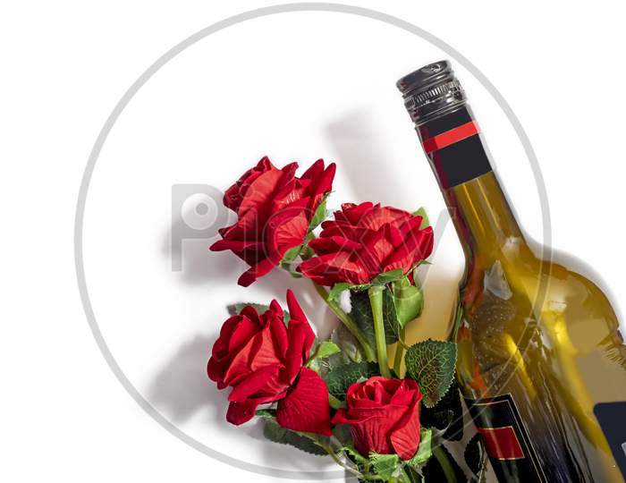 Valentine'S Day Background. Wine Bottle With Bouquet Of Red Plastic Roses On Isolated White Background. Top View, Copy Space