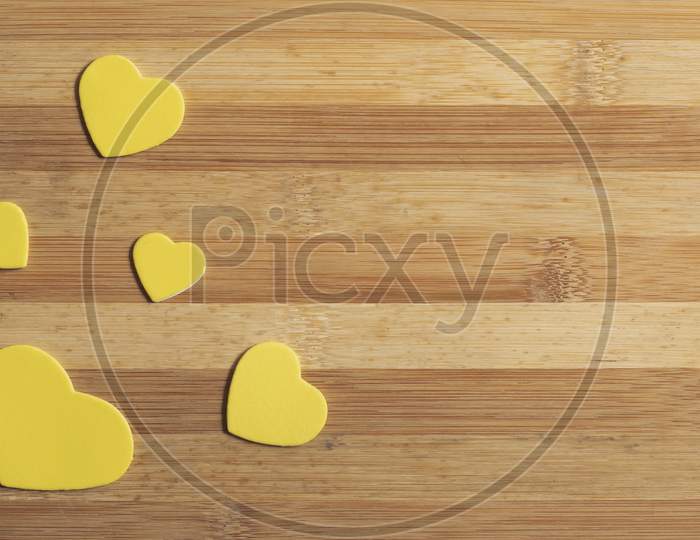 Valentines Day. Yellow Hearts On The Wooden Table, Top View