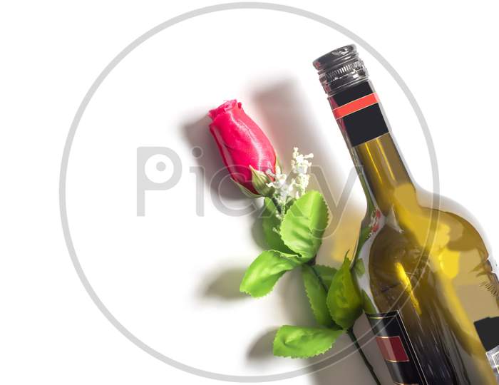 Valentine'S Day Background. Wine Bottle With Red Rose On Isolated White Background. Top View, Copy Space