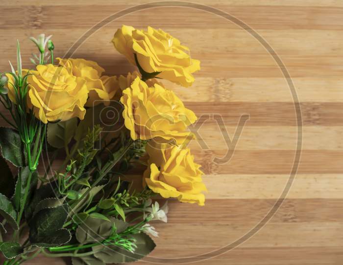 Valentine'S Day Backgrounds With A Bouquet Of Yellow Roses On A Wooden Table