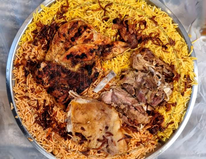 Mandi and Kabsa Rice with Grilled Chicken and Mutton Meat.