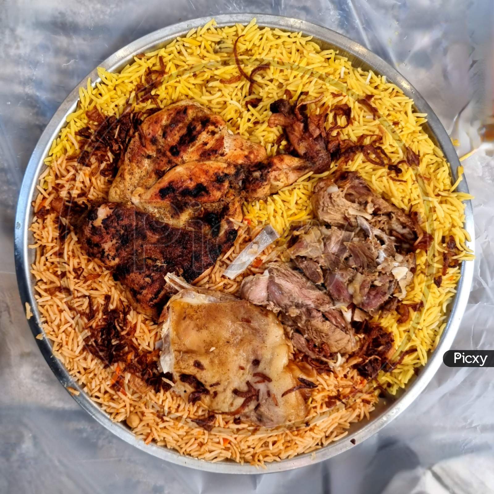 Mandi and Kabsa Rice with Grilled Chicken and Mutton Meat.