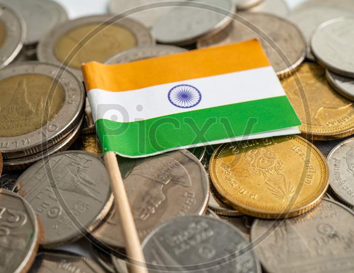 India Flag On Coins Background, Finance And Accounting, Banking Concept.
