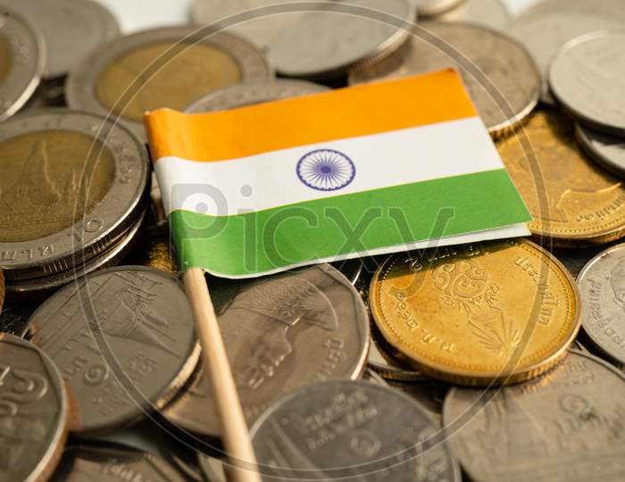 Stack Of Coins With India Flag On White Background. Flag On White Background.