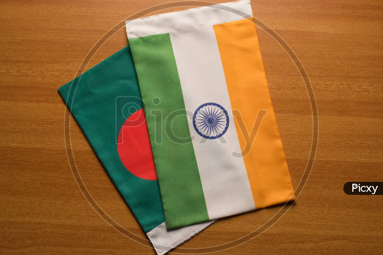 Bangladesh And Indian Flags Placed On Table.