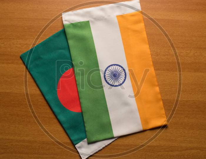 Bangladesh And Indian Flags Placed On Table.
