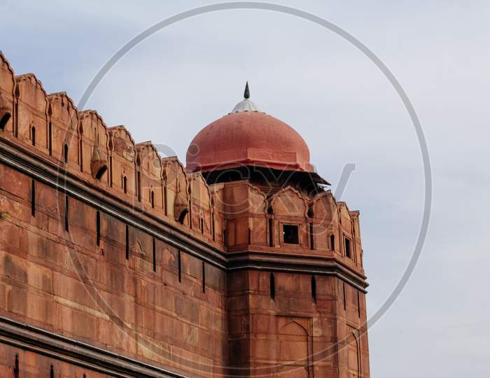 India Travel Tourism Background - Red Fort (Lal Qila) Delhi - World Heritage Site. Inside View Of The Red Fort, Ancient Tower Of Red Stone In The Fortress The Dom