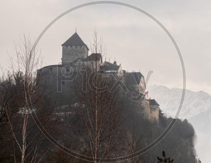 Vaduz, Liechtenstein, December 14, 2021 Historic Castle On A Foggy Day