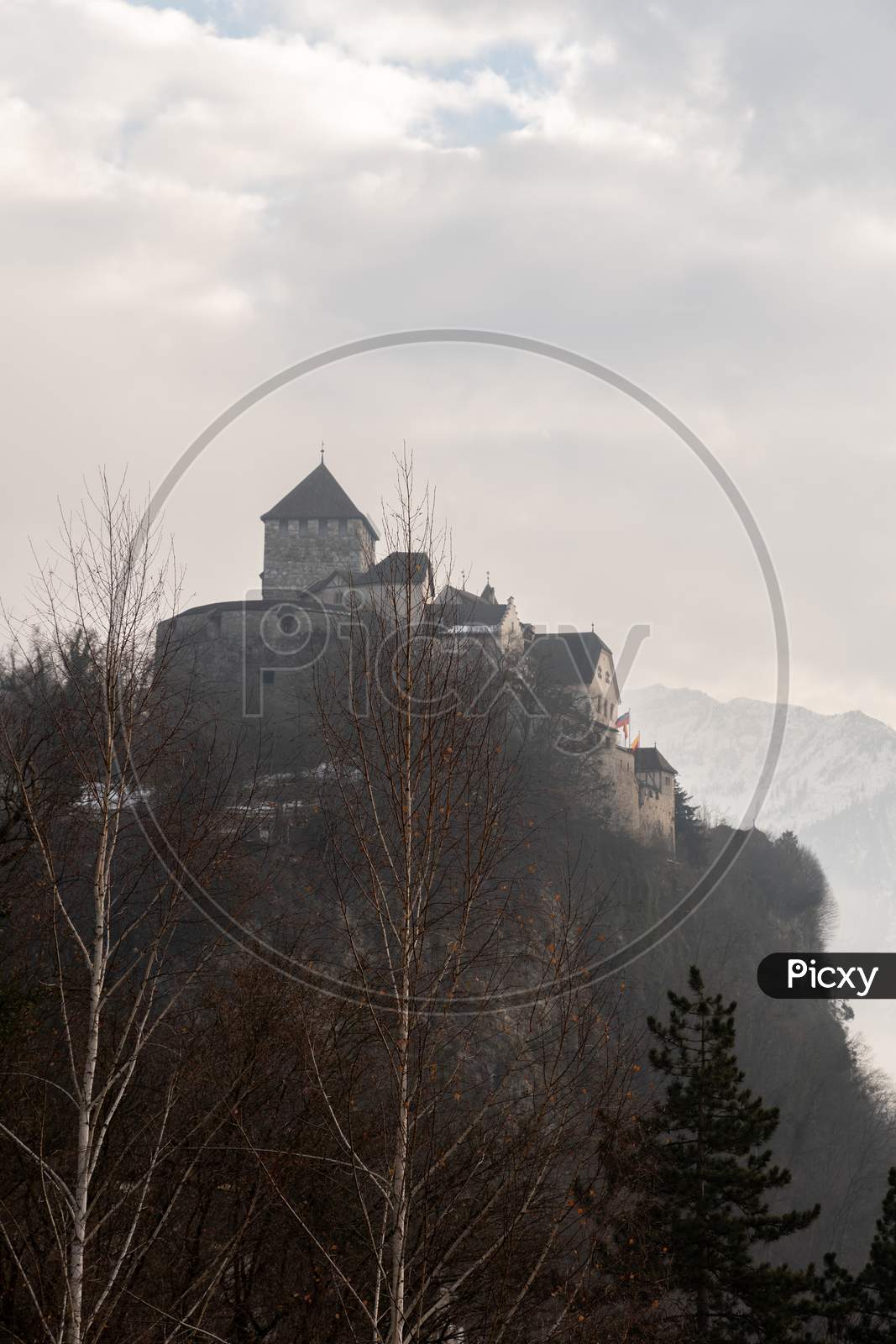 Vaduz, Liechtenstein, December 14, 2021 Historic Castle On A Foggy Day