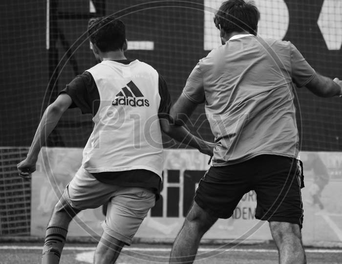 New Delhi, India - July 01 2018: Footballers Of Local Football Team During Game In Regional Derby Championship On Football Pitch. Hot Moment Of Football Match On Grass Field Stadium - Black And White