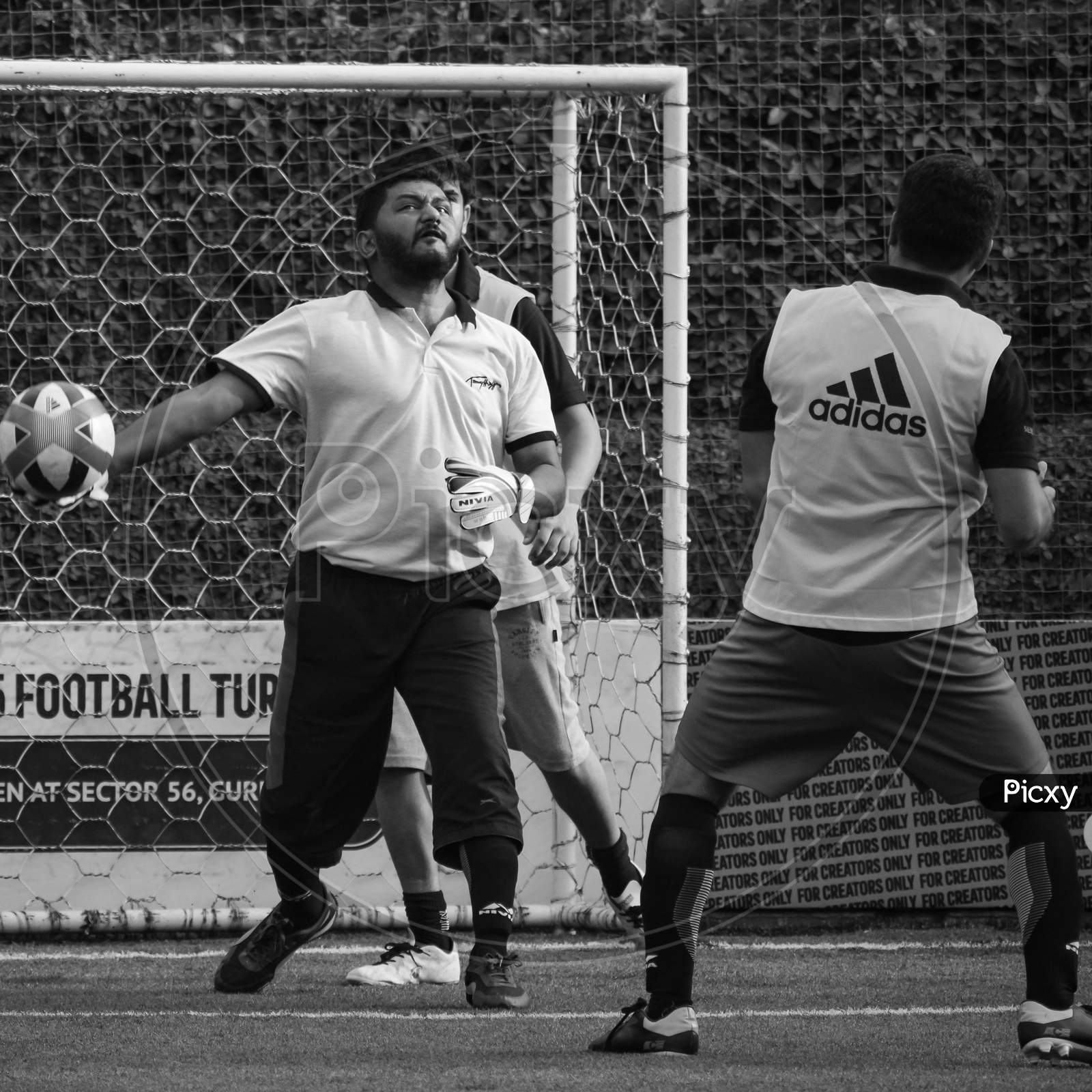 New Delhi, India - July 01 2018: Footballers Of Local Football Team During Game In Regional Derby Championship On Football Pitch. Hot Moment Of Football Match On Grass Field Stadium - Black And White