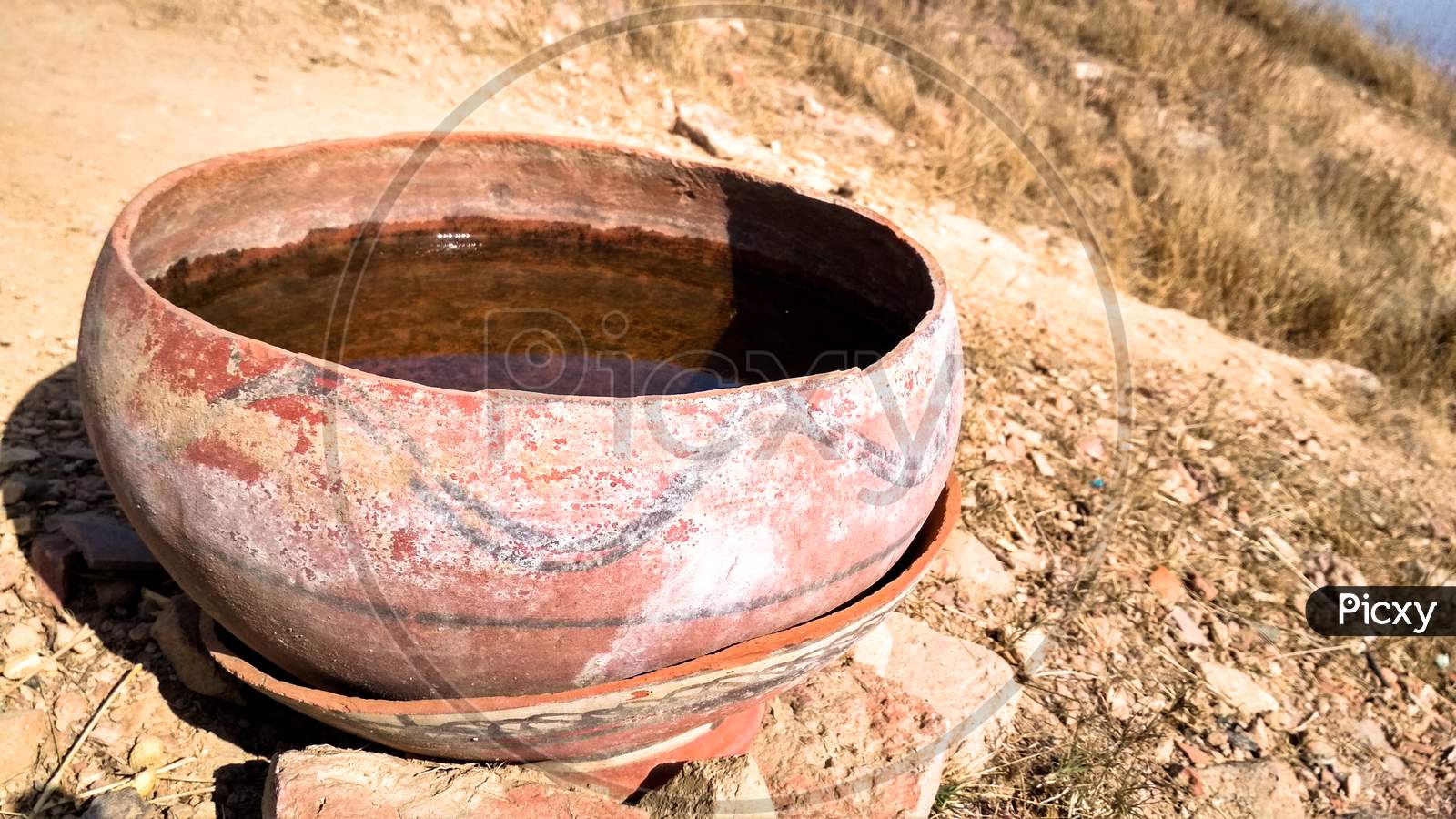 Water In A Clay Pot For Birds To Drink In Summer Weather
