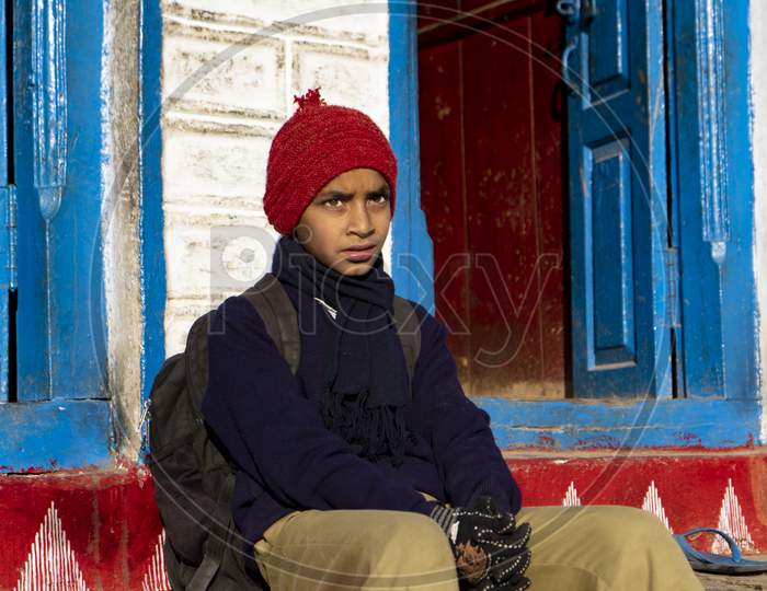 Portrait Of A Young Indian Village Kid Dressed Up For School.