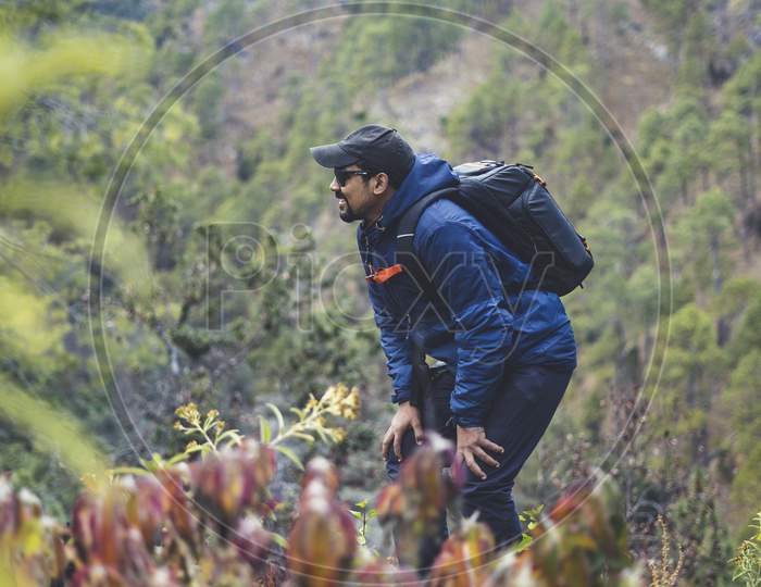 Young India Hipster Boy Backpack Enjoying Trekking On The Peak Of Mountain. Tourist Traveler On Background View Mockup.