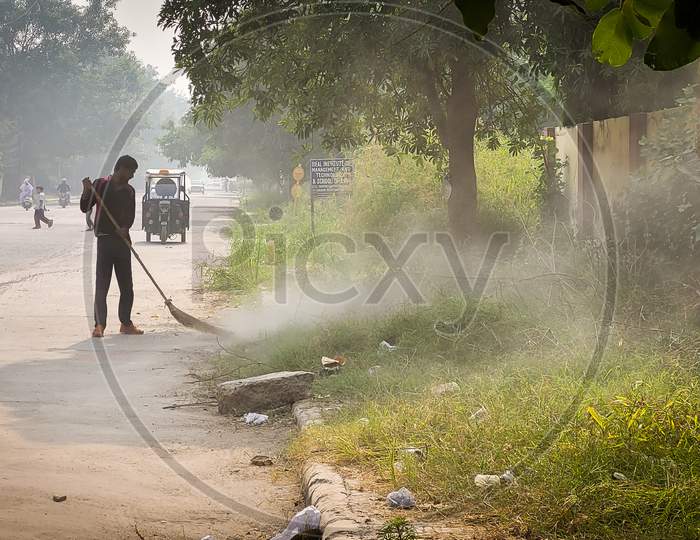 Cleaning Of Street By Government Worker