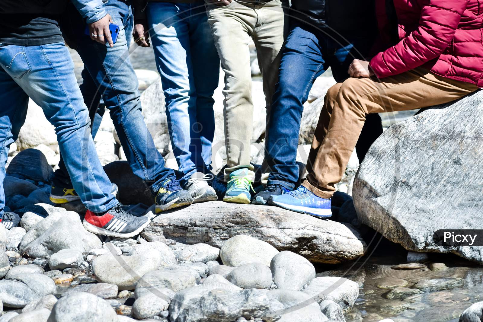 Image of People Putting Legs Together , Close-Up. Friends On Holiday ...