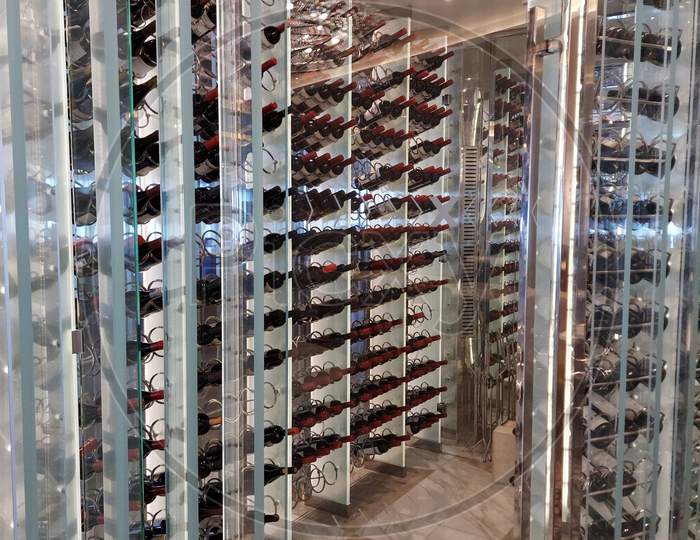Beautifully Arranged Wine Bottles Display On A Cruise Ship Restaurant Entrance