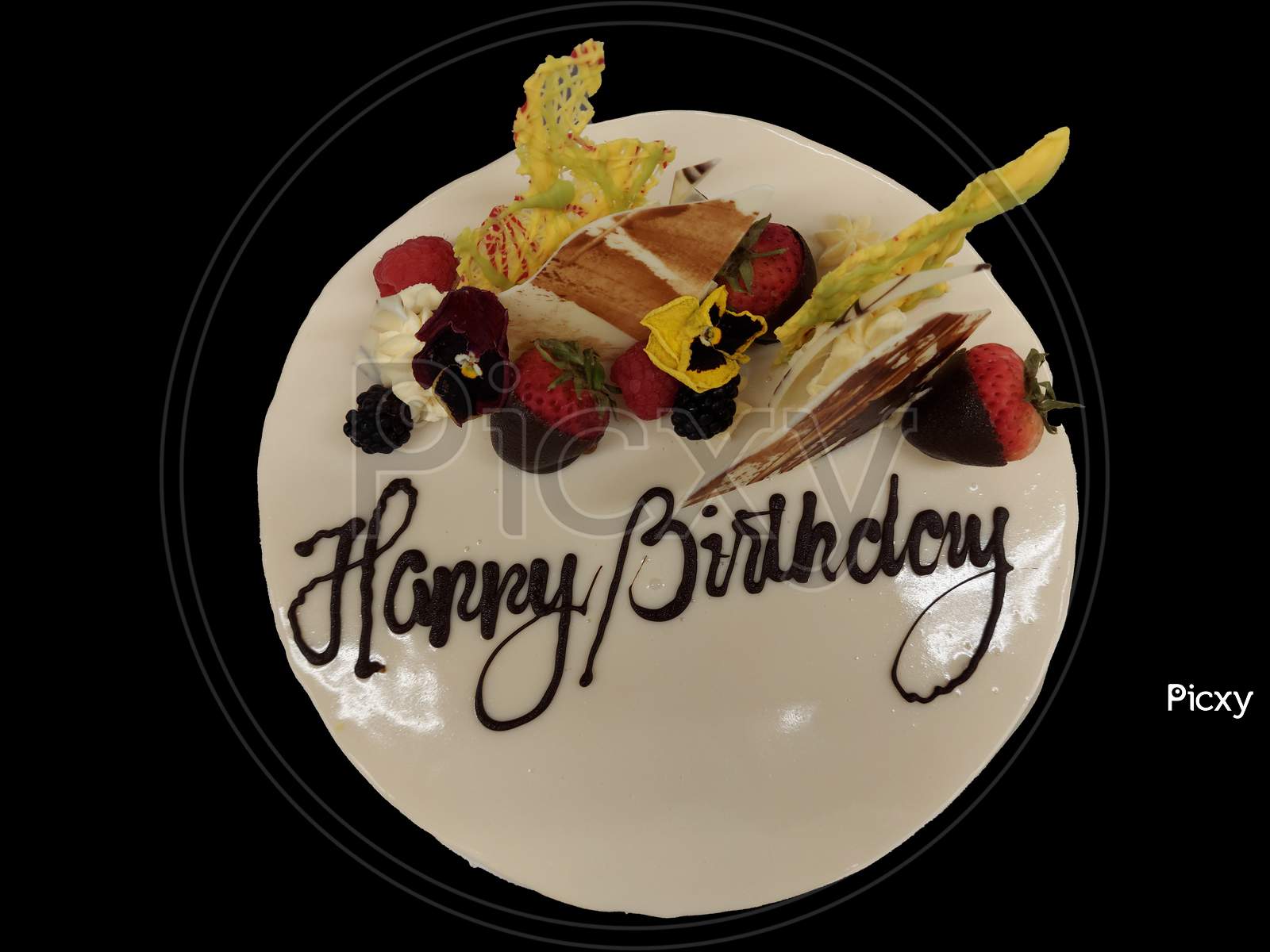 Celebration Cake With Happy Birthday Writing On It Isolated In Black Background
