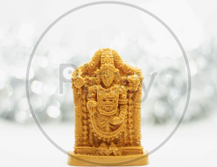 Wooden Tirupati Venkateswara Swamy Statue With Bokeh Effect Background