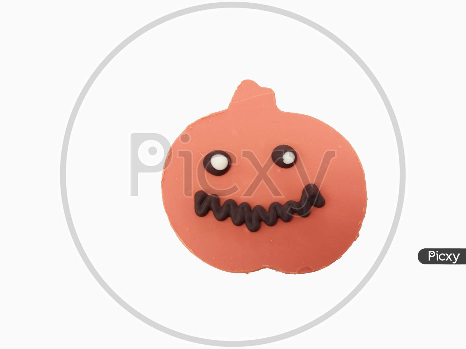 Scary Pumpkin Face On A Sable Cookies In White Background