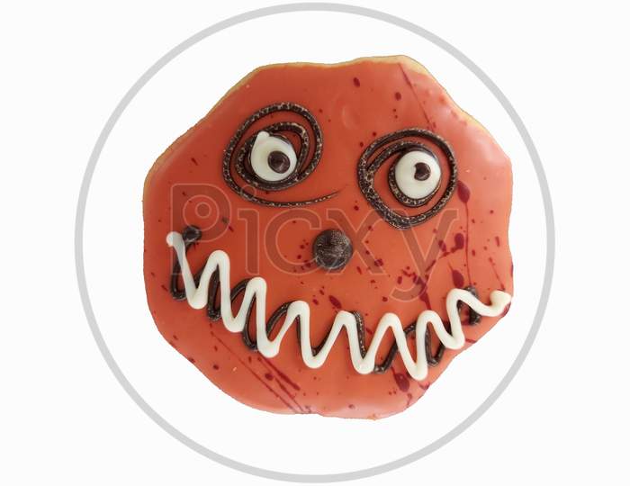 Scary And Spooky Face On A Cookies For Halloween In White Background