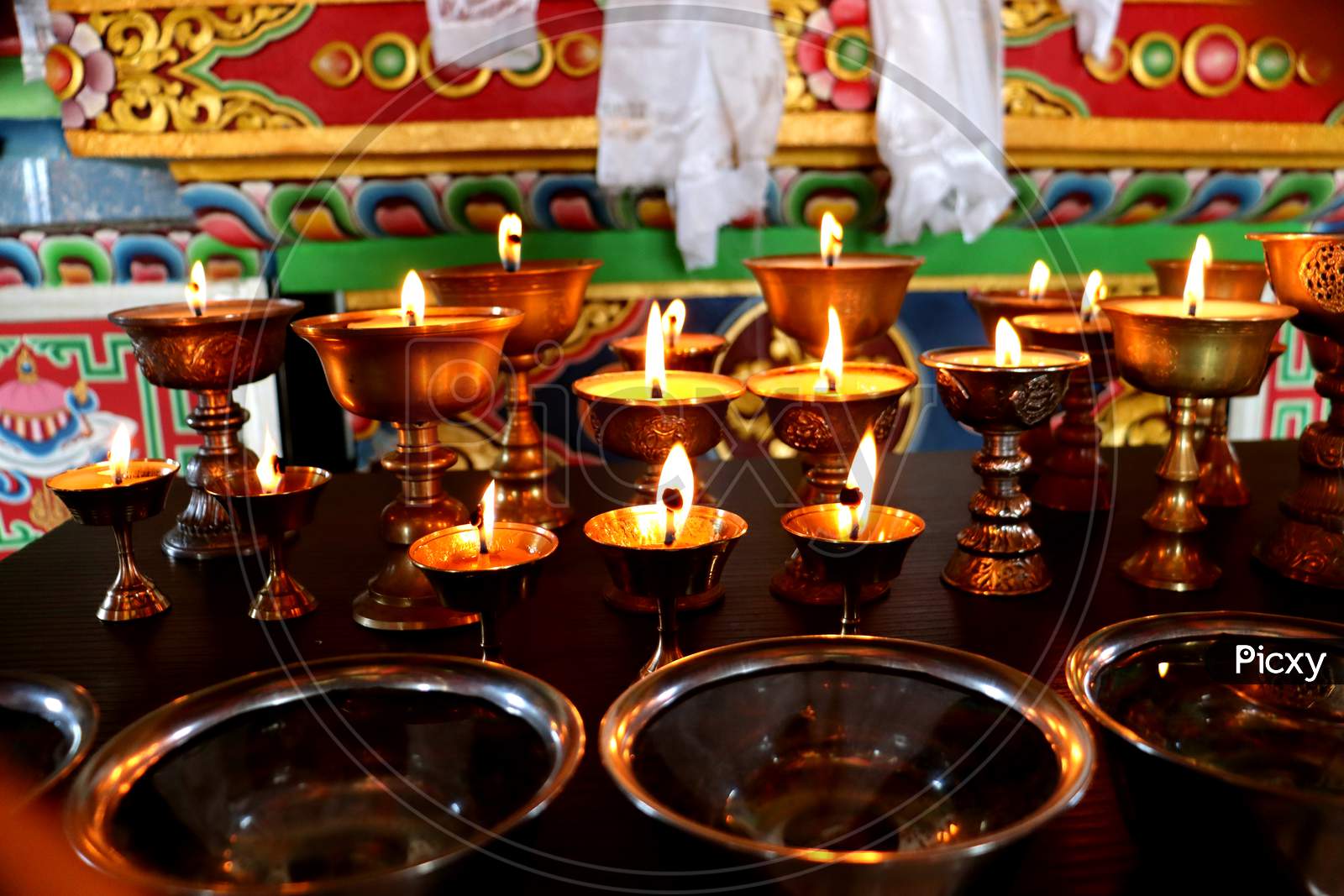 Candle Light,Beautiful Tranquil Scenic View Of Wax Lamps And Swaying Flame For Praying,Monastery Or A Charge