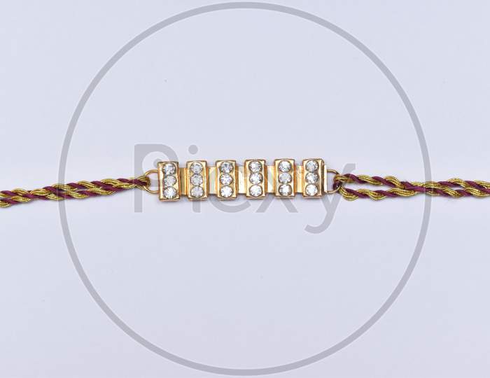 A Traditional Indian Wrist Band Which Is A Symbol Of Love Between Sisters And Brothers.
