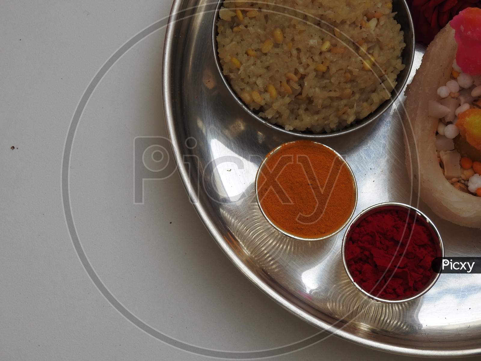 Group Of Pongal Or Makara Sankranti Festival Foods In A Silver Plate Isolated On White Background