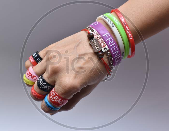 Hand Wrist With Friendship Bands And Friendship Rings On The Occasion Of Friendship Day