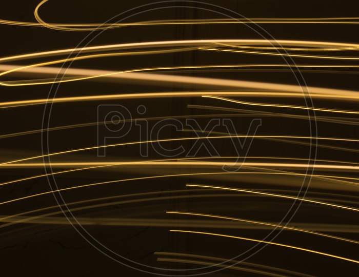 Abstract Colorful Irregular Lines On Black Background Photo With Long Exposure.Light Painting Photography.Lights With Irregular Patterns For Overlay